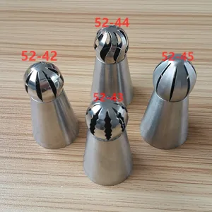 Detailed close-up of four stainless steel Russian torch spherical piping tips for cakes