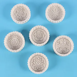 Macro view of six silicone molds featuring diverse floral and snowflake patterns for DIY.
