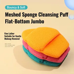 Detailed view of three stacked porous foam cleansing sponges in orange, pink, and teal colors.