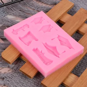 Detail view of pink graduation hat and scroll themed silicone fondant mold for cake decoration