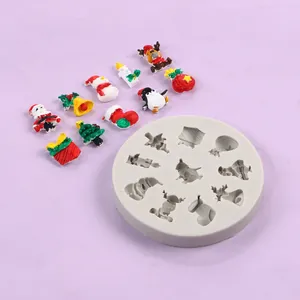 White silicone mold featuring various Christmas shapes with colorful resin samples
