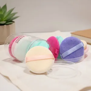 Set of 6 colorful round makeup powder puffs in a transparent cylinder storage box.