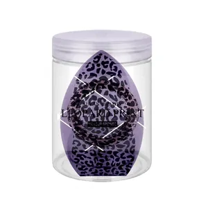 Close-up shot of purple leopard print makeup sponges inside a clear plastic jar