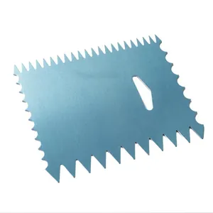 Detailed close-up of a blue aluminum cake cream scraper with multiple sawtooth edges