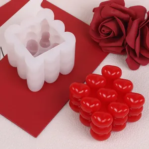 Detail view of heart magic cube silicone mold with red wax finished product