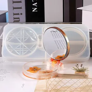 Detailed view of DIY resin silicone mold and finished handmade floral compact mirror