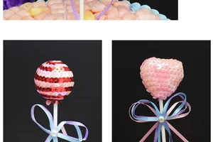 Macro detail of sequined cake toppers in round and heart shapes with elegant ribbons