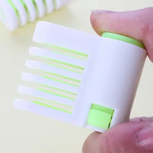Detailed view of a green and white DIY cake bread slicer for precise layer cutting
