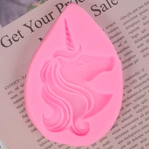 Close-up view of pink unicorn head silicone mold with detailed mane and horn texture.