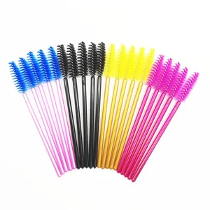 Close-up view of colorful disposable mascara brushes arranged in a symmetrical fan shape.