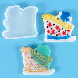 Macro view of a DIY Christmas sleigh silicone mold with finished resin star charms