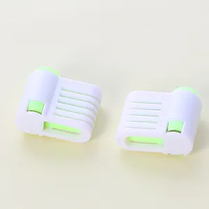 Close-up detail of the five-layer adjustment slots on cake slicer leveling tools.