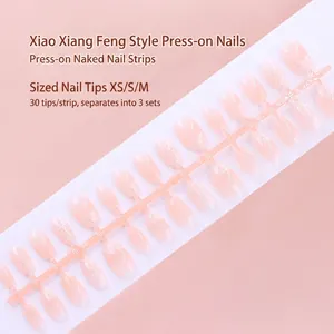 Macro view of 30pcs nude pink gradient press-on nail tips strip in XS, S, M sizes.