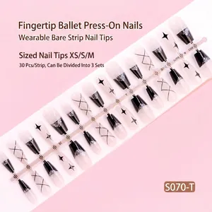 Detailed shot of 30pcs press-on nails featuring black stars and silver glitter accents