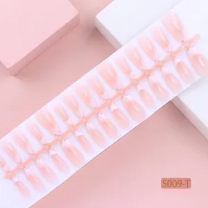 Macro detail of 30pcs ice translucent pink press-on nails strip with XS/S/M sizing