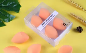 Set of 4 soft orange non-latex slanted makeup sponges in clear gift box packaging