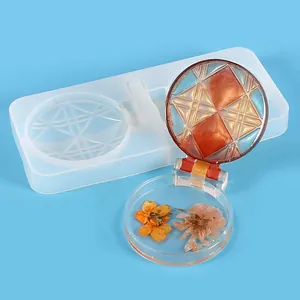 Detailed view of DIY resin mold and finished geometric diamond compact mirror