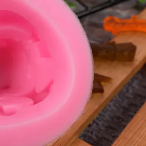 Macro detail showing the smooth texture of the pink graduation cap silicone mold