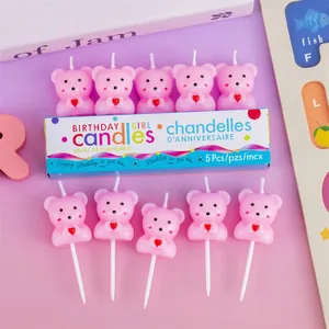 Detailed view of 10 adorable pink bear birthday candles with hearts and packaging.