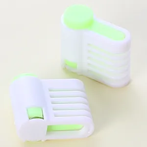Close-up of white and green plastic cake levelers for even layer cutting of cakes and bread.