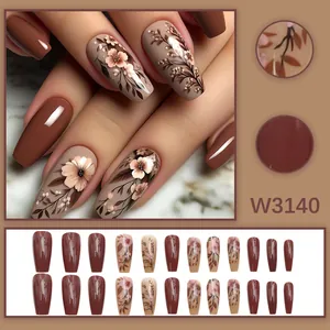 Close-up of retro floral patterns and full set of caramel press-on nails.