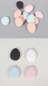 Detailed view of mini finger makeup sponges in various colors showing front and back