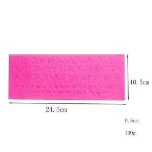 Detailed view of pink silicone alphabet fondant mold with dimension markings