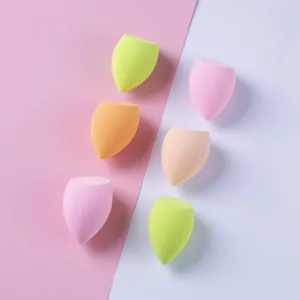 Set of 6 pastel diagonal cut makeup sponges on a pink and white background