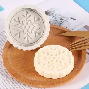 Close-up of snowflake pattern silicone mold and soap showing intricate details.