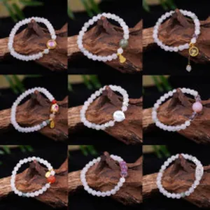 Detailed view of nine crystal bracelets with varied charms and natural beads