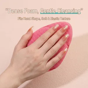 Macro detail of soft pink XXL thick honeycomb sponge mitt for deep facial cleansing
