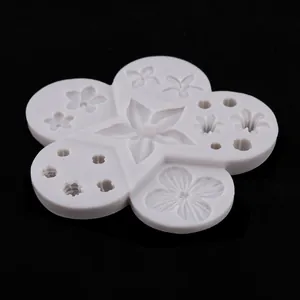 Close-up of silicone mold with daisy and sunflower floral patterns for cake decorating