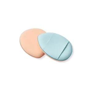 Detailed view of mini finger makeup puffs in peach and blue with a finger strap