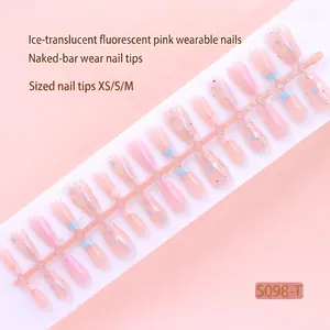 Detailed view of 30pcs pre-made ice pink press-on nails with glitter star patterns