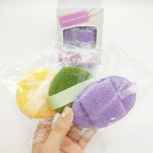 A set of three soft textured makeup remover puffs in yellow, green and purple colors