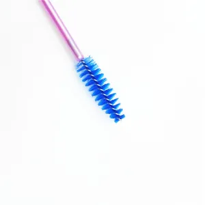 Close-up macro shot of blue spiral bristles on a pink disposable eyelash mascara wand