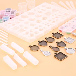 Comprehensive DIY resin jewelry making kit with silicone molds and metal bezel pendants.