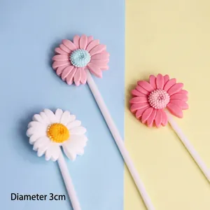 Macro view of resin daisy cake toppers with 3cm diameter for dessert decoration