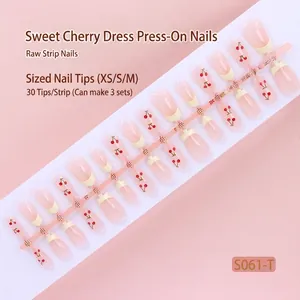 Detailed view of 30 pieces nude pink press-on nails featuring cute red cherry designs