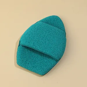 Close-up of a thick teal exfoliating glove facial sponge for deep skin cleansing