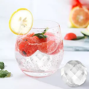 Detailed close-up showing a crystal-clear diamond ice cube with a refreshing fruit drink.