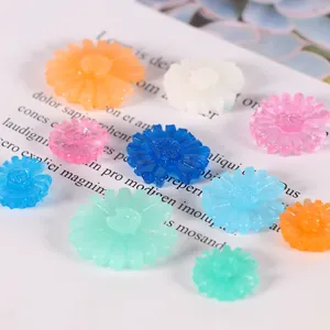 Macro detail of various colorful resin daisy flowers for cake decoration and DIY crafts