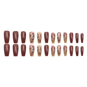 High-gloss caramel coffee press-on nails with delicate floral branch patterns