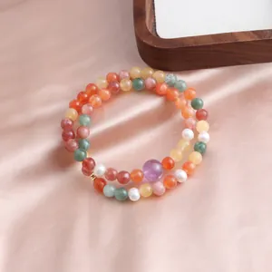 Detailed macro shot of the colorful double-strand jade and crystal beaded bracelet