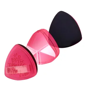 Close-up detail of triangle makeup puffs with a pink transparent storage case