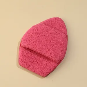 Detail view of thick pink XXL exfoliating sponge mitt with porous texture