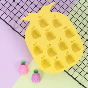 Close-up of yellow pineapple silicone mold with 12 cavities for baby food and ice cubes
