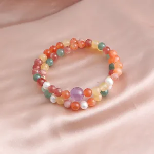 Close-up of double-loop beaded bracelet with multi-colored natural stones and pearls