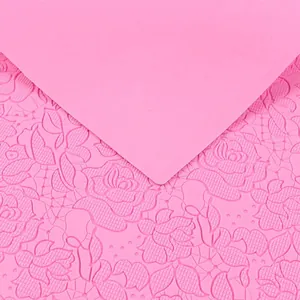 Detail view of pink silicone fondant lace mat with rose pattern for cake decorating