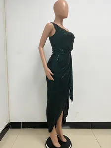 Elegant one-shoulder dark green sequin maxi dress with pleated waist detail on mannequin.